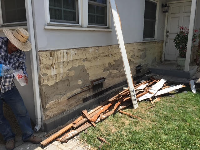 Stucco repair before with debris in Orlando